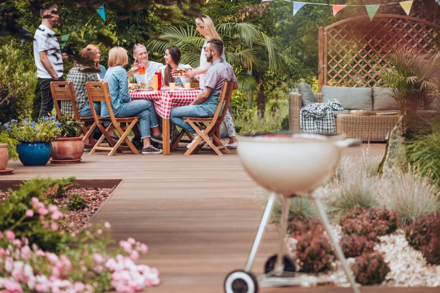 Guests enjoying outdoor dining on a landscaped patio during UAE winter