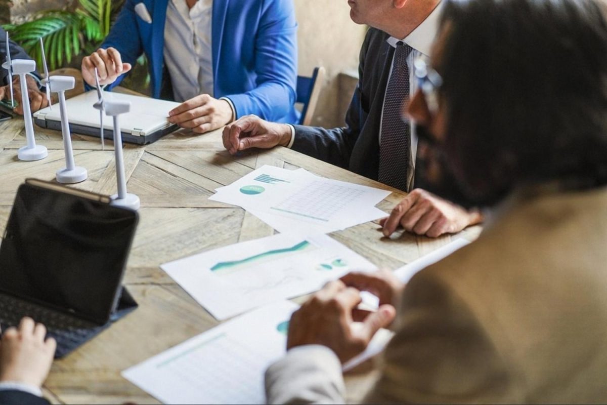 UAE business team discussing risk management strategy in a boardroom meeting